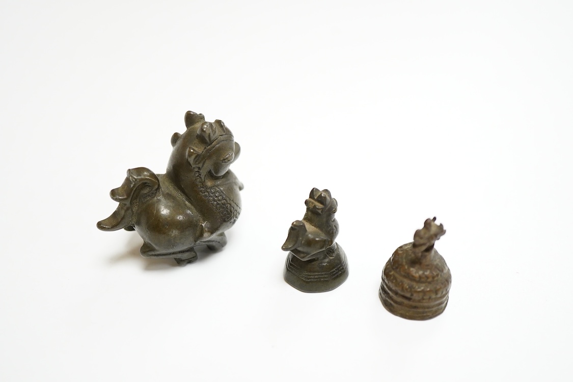 Two 19th century Burmese bronze weights, and a similar figure of a mythical beast, largest 4cm high